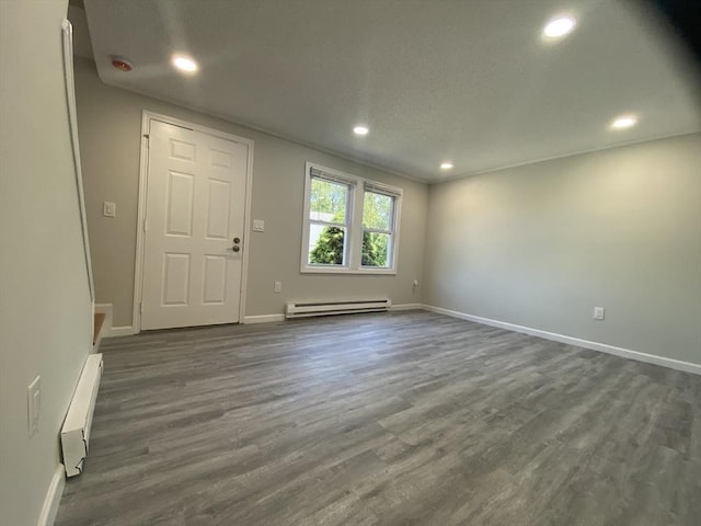 270 Sunderland Rd Unit 11, Worcester, MA 01604 - entryway featuring baseboard heating, a baseboard radiator, baseboards, recessed lighting, and dark wood-style flooring