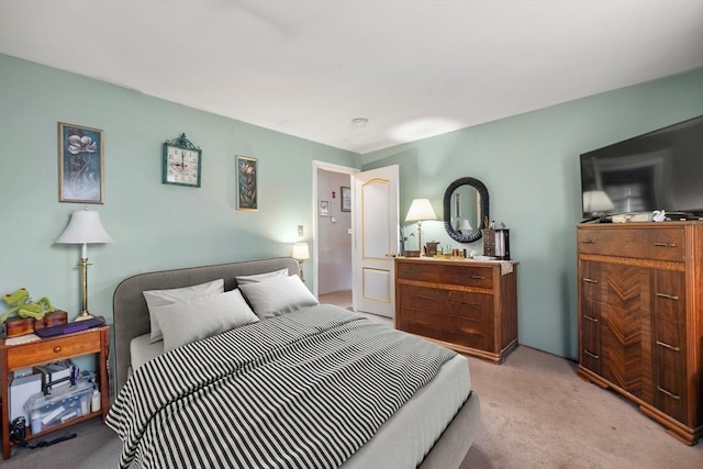 bedroom featuring light carpet