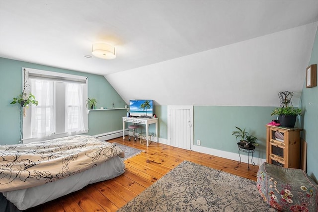 60 Lynnfield St, Lynn, MA 01904 - bedroom featuring hardwood / wood-style flooring, a baseboard radiator, baseboards, and lofted ceiling