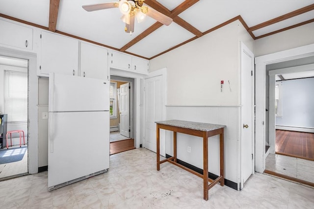 60 Lynnfield St, Lynn, MA 01904 - kitchen featuring freestanding refrigerator, a baseboard radiator, a ceiling fan, healthy amount of natural light, and wainscoting