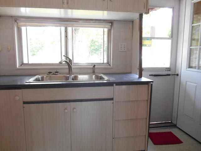3 Anderson Ave, Worcester, MA 01604 - kitchen with a sink, dark countertops, and light brown cabinets
