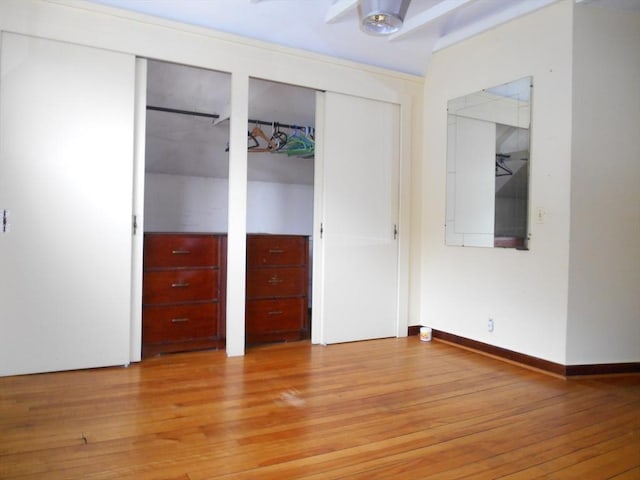 3 Anderson Ave, Worcester, MA 01604 - unfurnished bedroom with two closets, light wood-type flooring, and baseboards