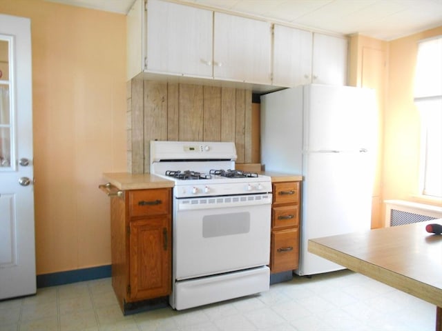 3 Anderson Ave, Worcester, MA 01604 - kitchen featuring white appliances, light countertops, and baseboards