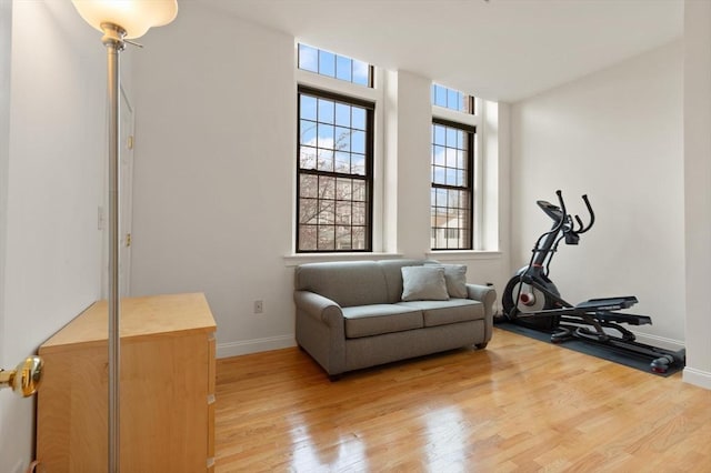 interior space with baseboards and light wood-style flooring