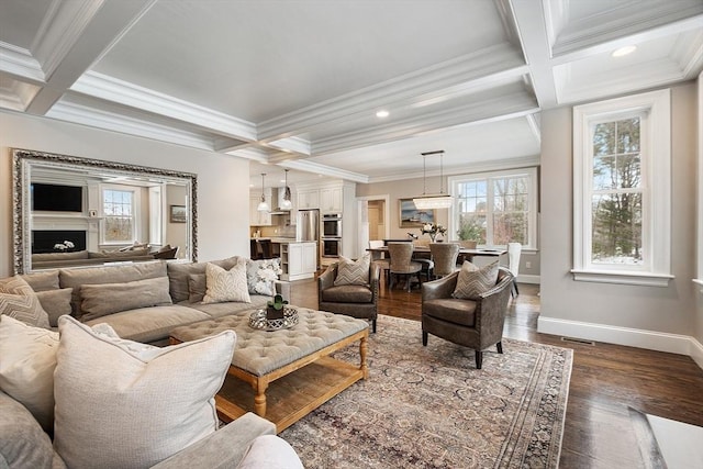 living room featuring baseboards, coffered ceiling, wood finished floors, and beamed ceiling