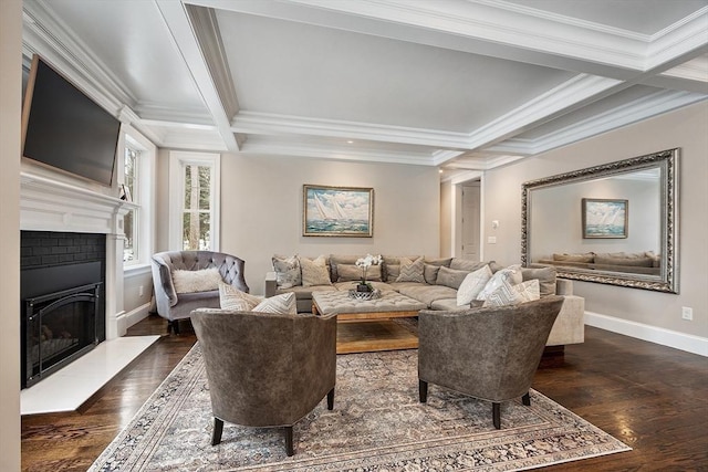 living area with baseboards, coffered ceiling, a fireplace with raised hearth, dark wood-style floors, and beam ceiling