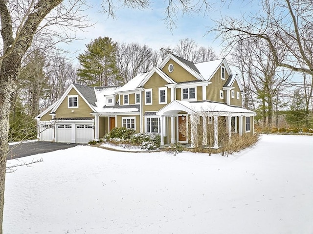 view of front of property with driveway and an attached garage