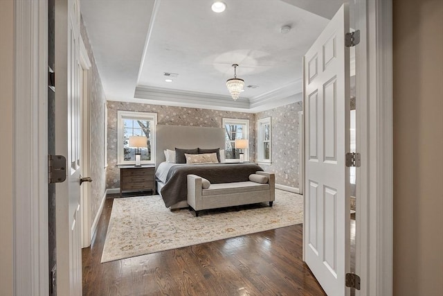 bedroom with wallpapered walls, baseboards, visible vents, a raised ceiling, and dark wood-style flooring