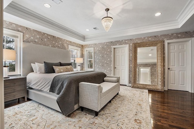 bedroom with ornamental molding, multiple windows, and visible vents