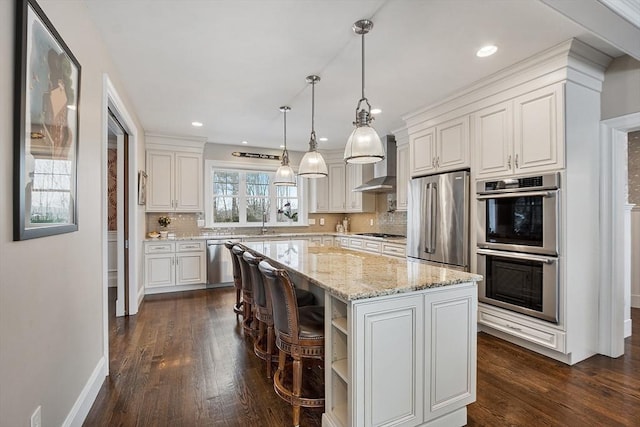 kitchen with stainless steel appliances, a kitchen island, white cabinetry, wall chimney range hood, and open shelves