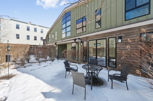 snow covered patio with fence