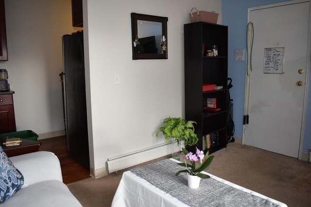 interior space featuring baseboard heating