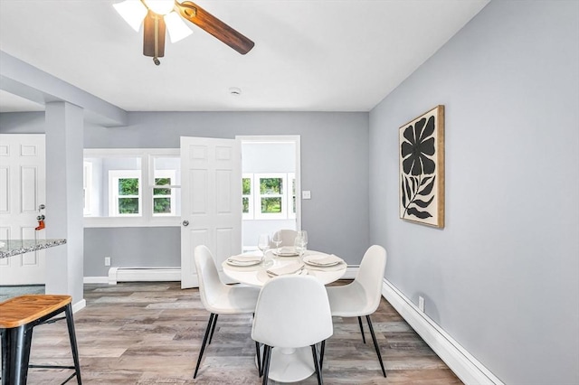 759 Millers Falls Rd, Northfield, MA 01360 - dining space featuring a baseboard radiator, wood finished floors, and a ceiling fan