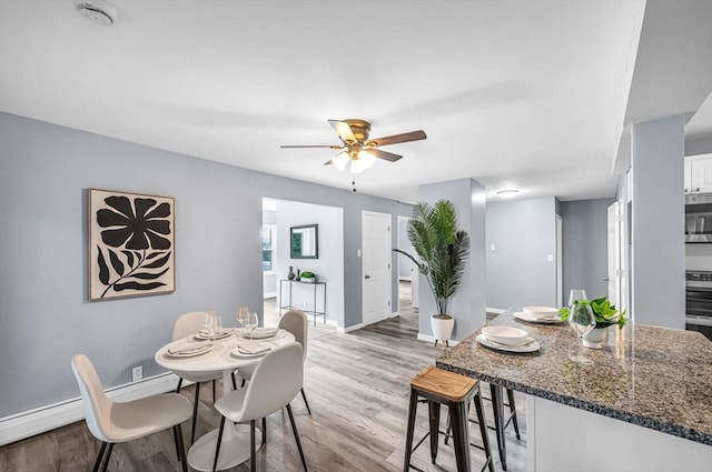 759 Millers Falls Rd, Northfield, MA 01360 - dining space with light wood finished floors and a ceiling fan