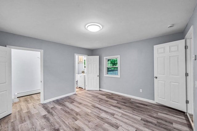 759 Millers Falls Rd, Northfield, MA 01360 - unfurnished bedroom with baseboard heating and wood finished floors
