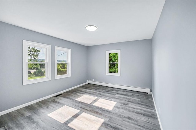 759 Millers Falls Rd, Northfield, MA 01360 - empty room featuring baseboard heating, healthy amount of natural light, and wood finished floors