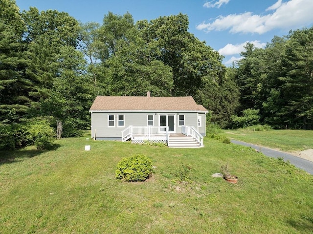 759 Millers Falls Rd, Northfield, MA 01360 - manufactured / mobile home featuring a front yard, a wooden deck, and a forest view