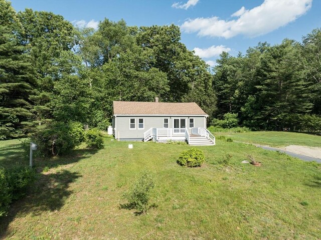 759 Millers Falls Rd, Northfield, MA 01360 - manufactured / mobile home with a wooden deck, a front yard, and a view of trees
