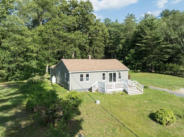 759 Millers Falls Rd, Northfield, MA 01360 - view of front of property with a wooden deck, a front yard, a forest view, and a shingled roof