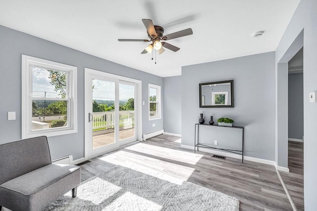 759 Millers Falls Rd, Northfield, MA 01360 - doorway to outside with baseboard heating, a baseboard radiator, healthy amount of natural light, and ceiling fan