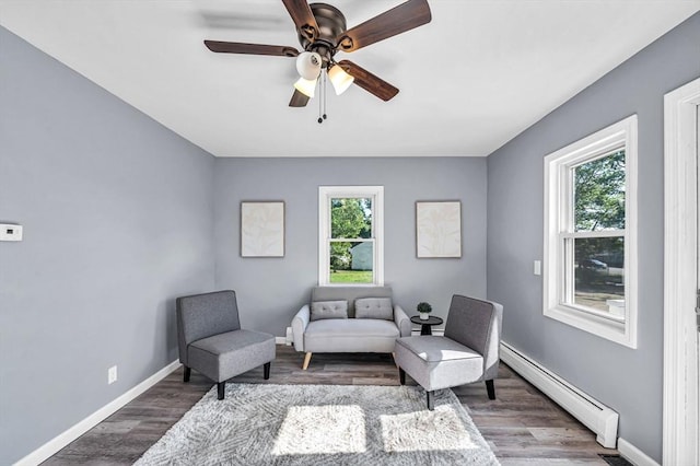 759 Millers Falls Rd, Northfield, MA 01360 - living area featuring a baseboard heating unit, wood finished floors, and ceiling fan