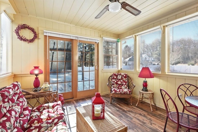 sunroom / solarium with a wealth of natural light, wood ceiling, and a ceiling fan