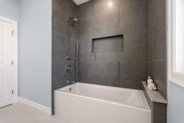 full bath featuring baseboards, shower / tub combination, and tile patterned flooring