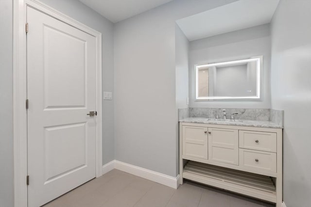 bathroom with baseboards and vanity
