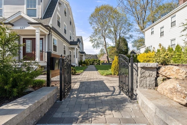 exterior space featuring a gate, a gated entry, and driveway