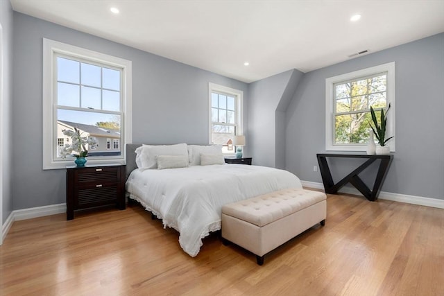 bedroom featuring recessed lighting, baseboards, visible vents, and light wood-type flooring
