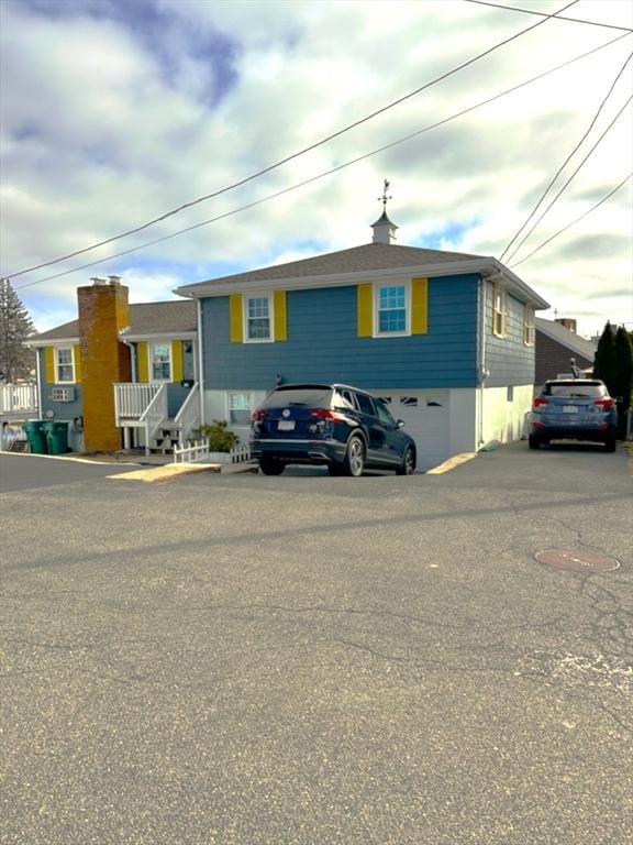 view of front of property with driveway and an attached garage