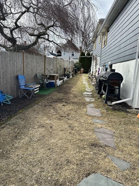 view of yard featuring fence