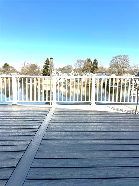 deck featuring a water view