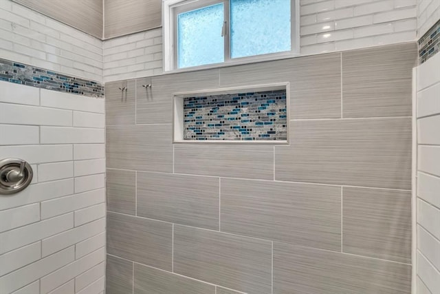 full bath featuring a tile shower