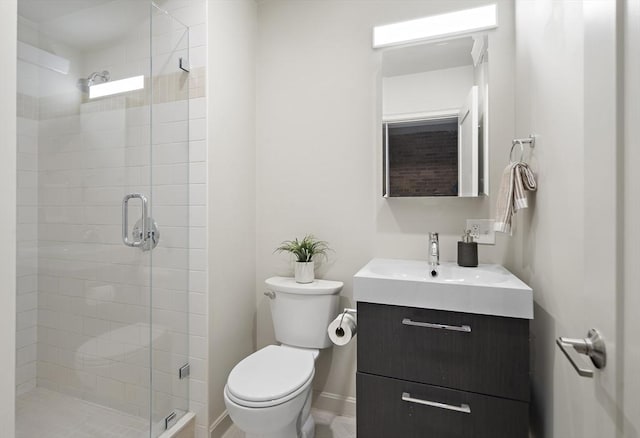 full bathroom with a shower stall, toilet, and vanity