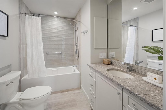 full bathroom with toilet, shower / bath combo with shower curtain, recessed lighting, and vanity
