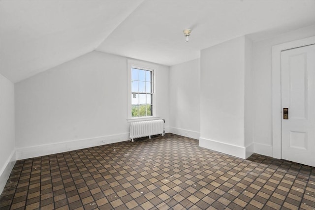 33 Wellington Ln, Belmont, MA 02478 - bonus room featuring radiator heating unit, lofted ceiling, and baseboards
