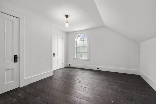 33 Wellington Ln, Belmont, MA 02478 - bonus room with dark wood-type flooring, vaulted ceiling, and baseboards