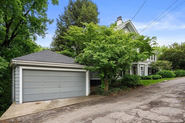 33 Wellington Ln, Belmont, MA 02478 - view of front facade with a detached garage and a chimney