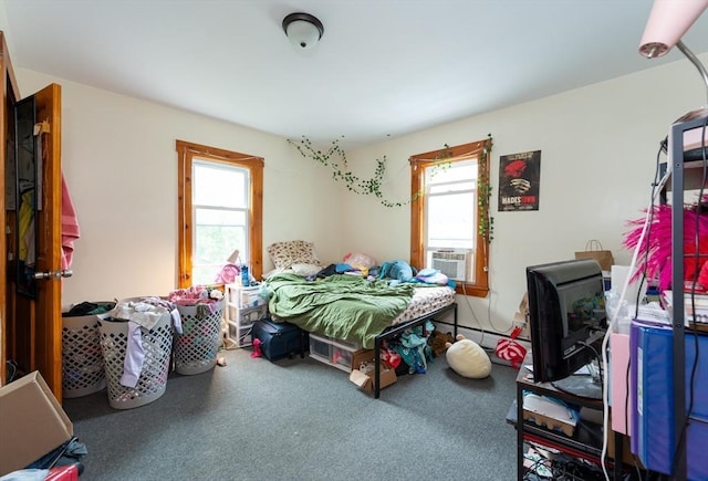 8 Everett St, Somerville, MA 02143 - carpeted bedroom featuring cooling unit and baseboard heating