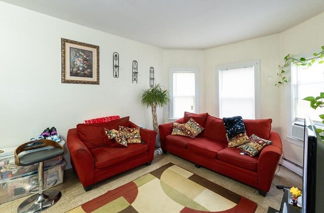 8 Everett St, Somerville, MA 02143 - living area featuring a baseboard heating unit and cooling unit