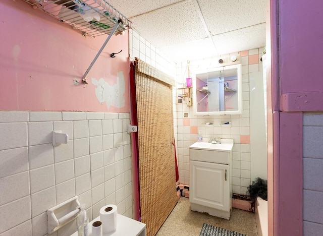 8 Everett St, Somerville, MA 02143 - bathroom featuring tile walls, a paneled ceiling, and vanity