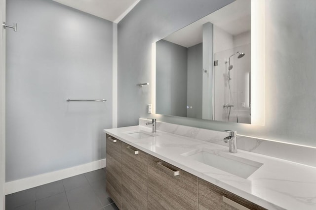 bathroom featuring tile patterned flooring, vanity, and an enclosed shower