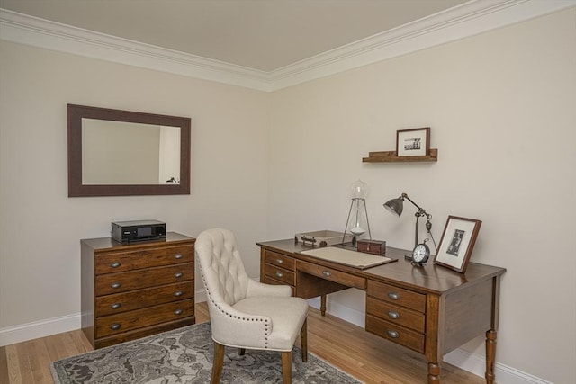 office area with light wood-type flooring and crown molding