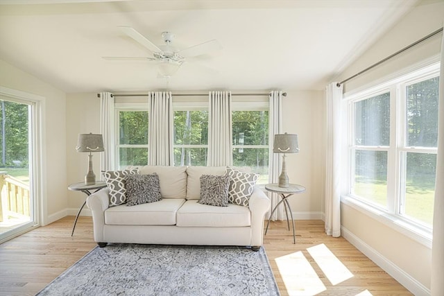 sunroom / solarium featuring ceiling fan and a healthy amount of sunlight