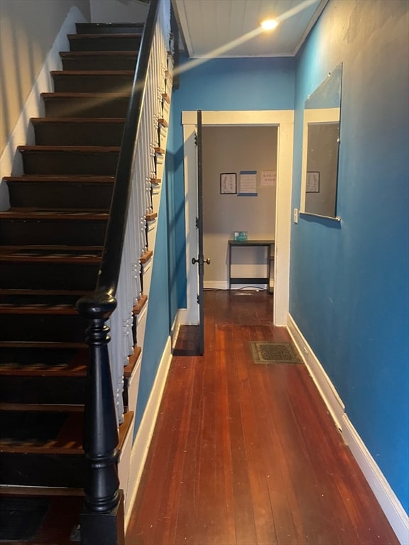 stairs with wood-type flooring