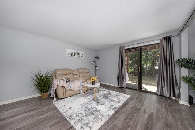 sitting room featuring dark wood-type flooring