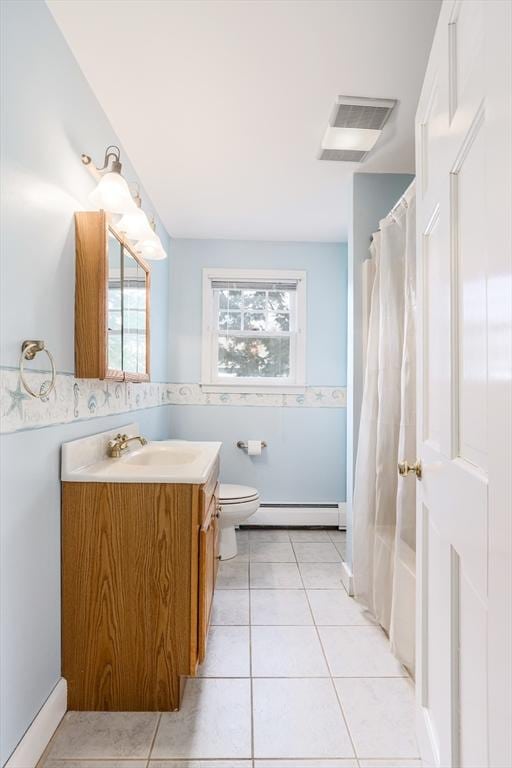 bathroom featuring visible vents, toilet, a baseboard radiator, tile patterned floors, and vanity