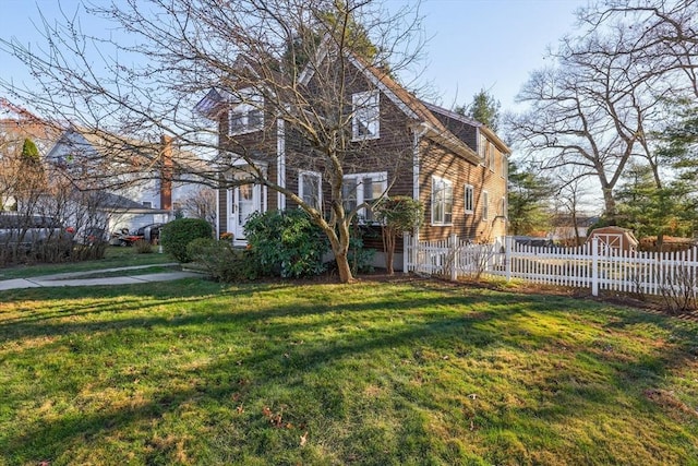 exterior space featuring a yard and fence