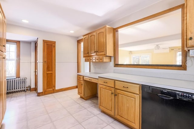 kitchen with dishwasher, light countertops, radiator heating unit, and baseboards